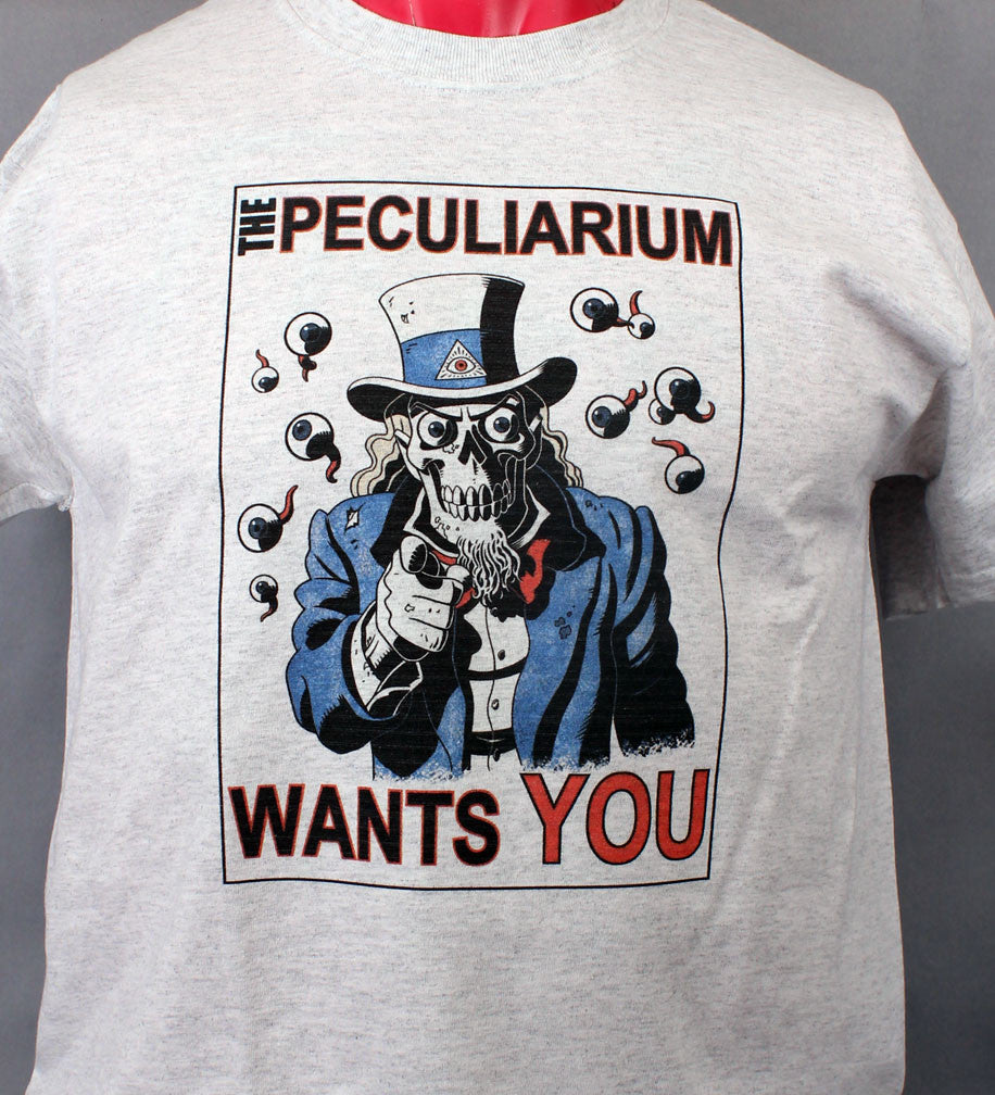 100% cotton tee with a skeletal Uncle Sam design, by Mike Wellins. Peculiarium Wants You.