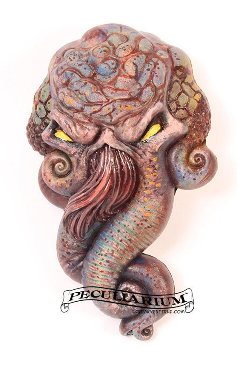 This is a sculpt of H.P. Lovecraft's iconic character, Cthulhu. It's stone cast from an original sculpt by master sculptor Colin Batty and each is individually hand painted. Thus, each one is a little different. It's about 4.5 inches from the top to bottom. Perfect for any nursery or babies room! Get yours today! Also available in Bronze, too! Send a note when you order if you'd like the faux bronze look.