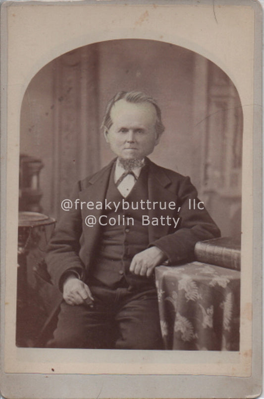 Seated Round Headed Man Print by Colin Batty